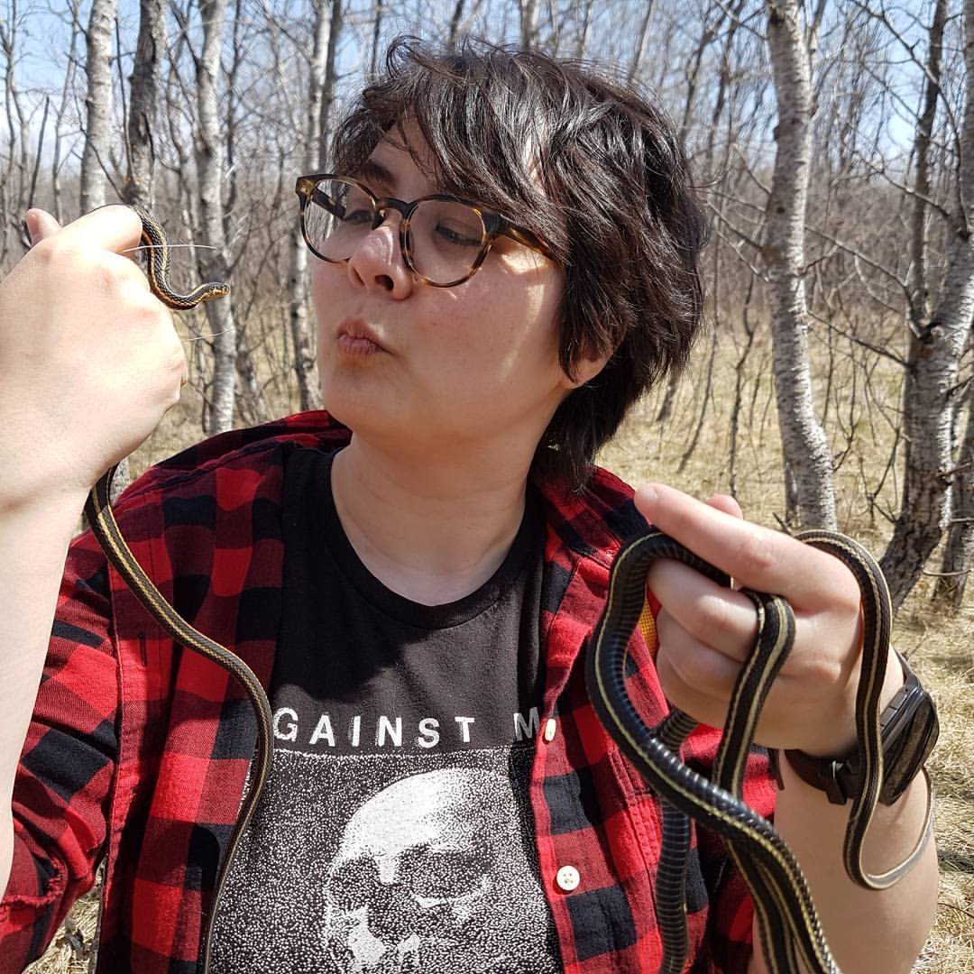 photo of tiff kissing some garter snakes